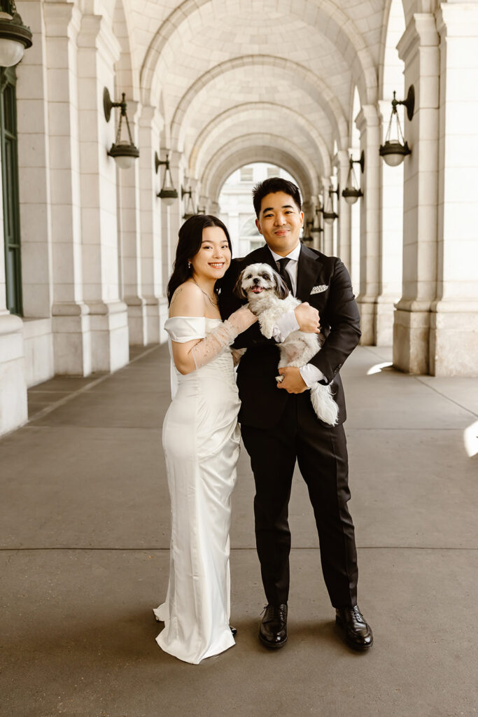 sweet couple with their pup during their washington dc self-officiated elopement
