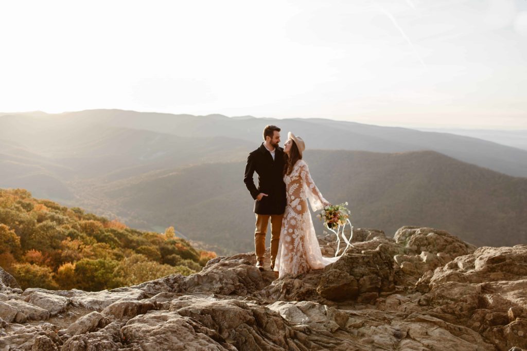 Bride and groom stand together at sunset during their Raven's Roost Elopement in the Virginia mountains.