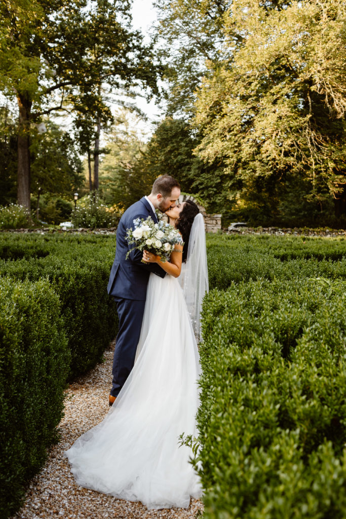 Wedding couple kiss after their ceremony at Airlie wedding venue during their Virginia Wedding.