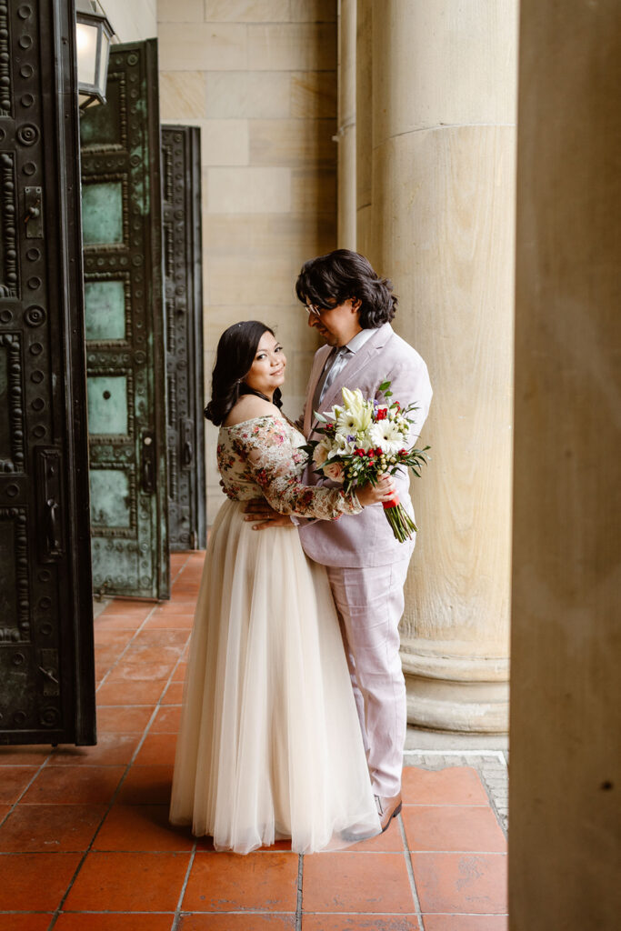 Wedding couple standing outside The Line Hotel during the Washington DC elopement