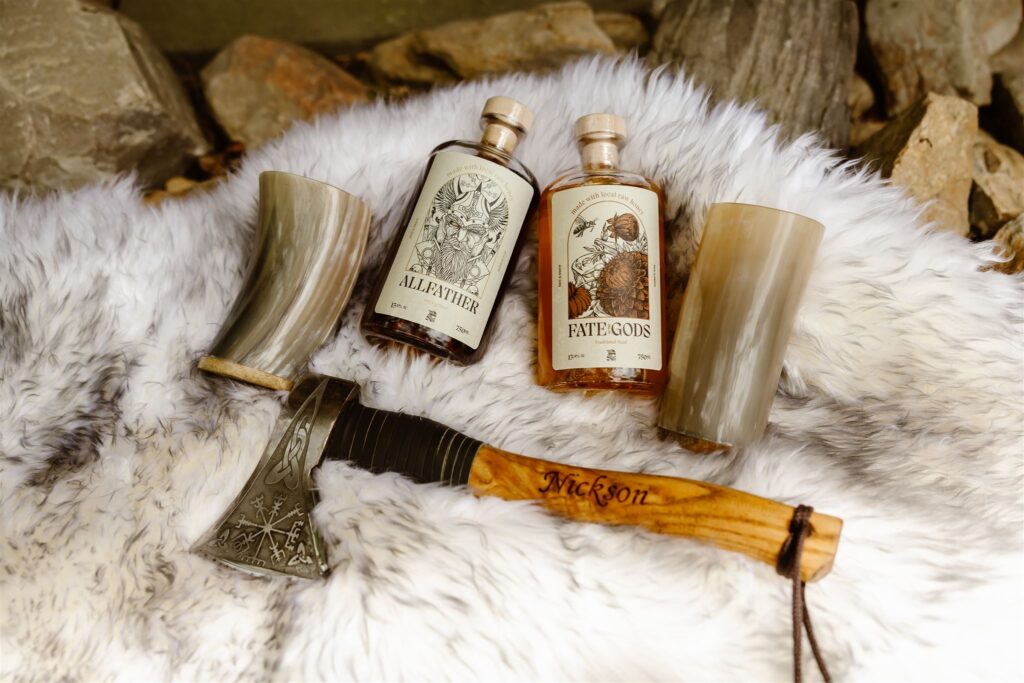 viking theme elopement details of mead, glasses and an axe