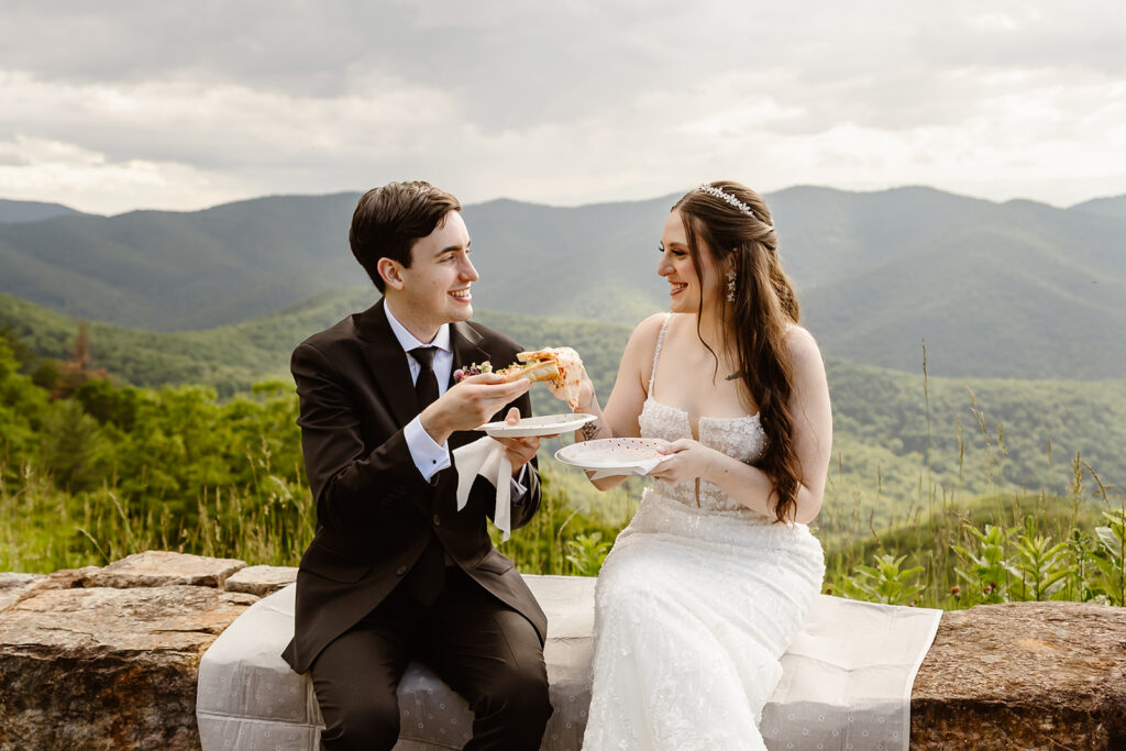 bride and groom enjoying a pizza picnic for their 8 hour elopement in shenandoah