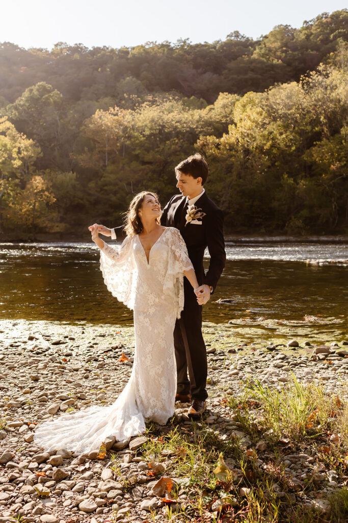 8 hour elopement in Shenandoah during sunrise by the water with colorful autumn trees in the backdrop