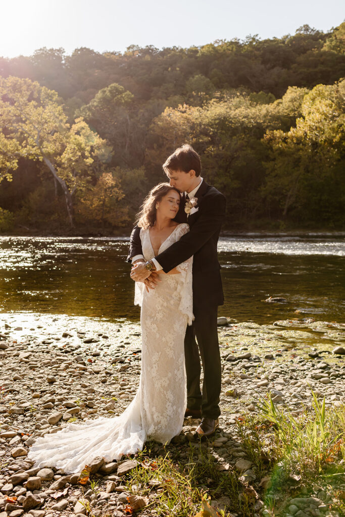 8 hour elopement in Shenandoah during sunrise by the water with colorful autumn trees in the backdrop