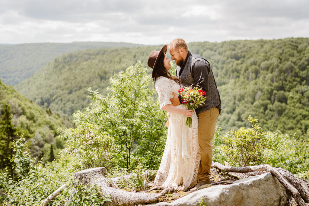 wedding couple on top of the mountains for elopement wedding photography