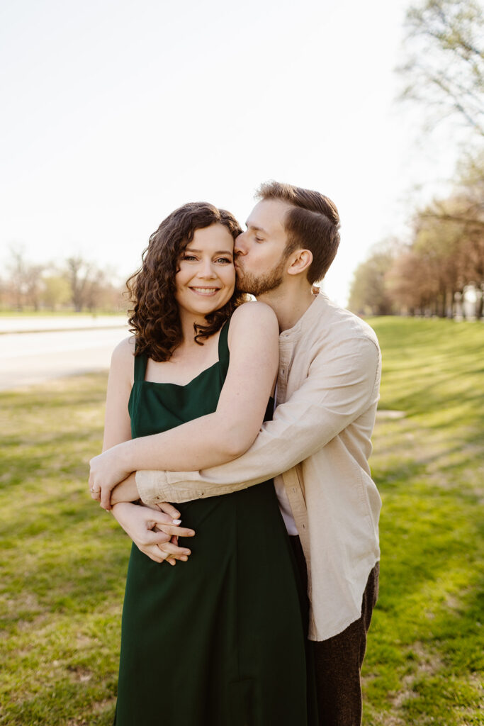The couple wrapped in a hug for romantic engagement photos in Washington DC