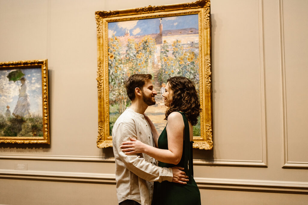 the couple looking at one another as they are surrounded by art in the National Gallery of Art in Washington DC