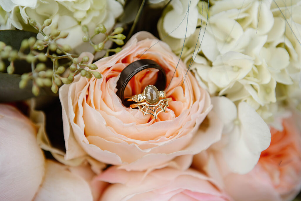 the wedding rings detail wedding photography in the bouquet