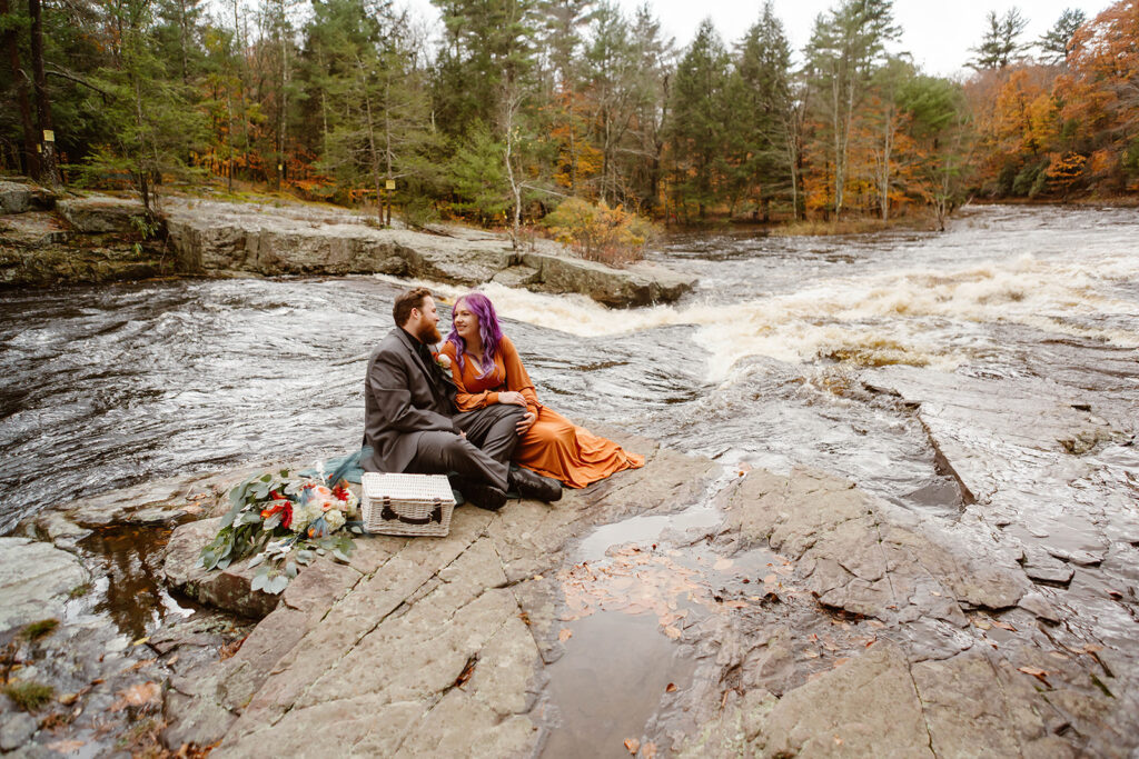 the wedding couple having a picnic after their elopement ceremony