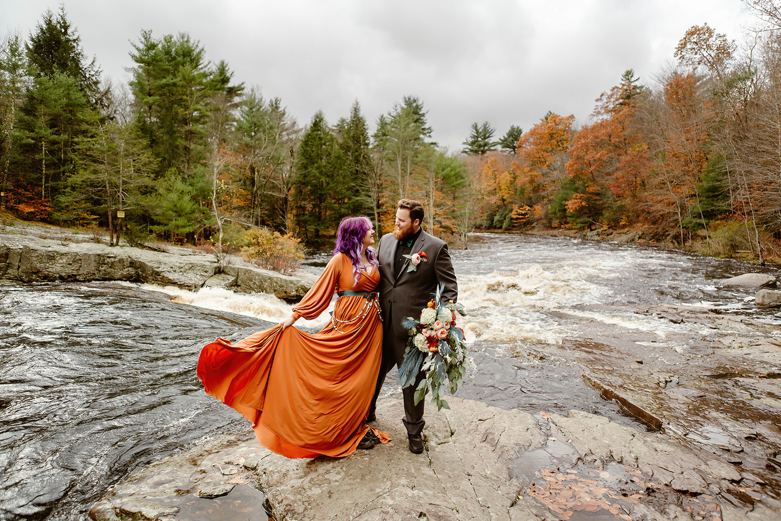 the bride and groom outdoors for their fall elopement