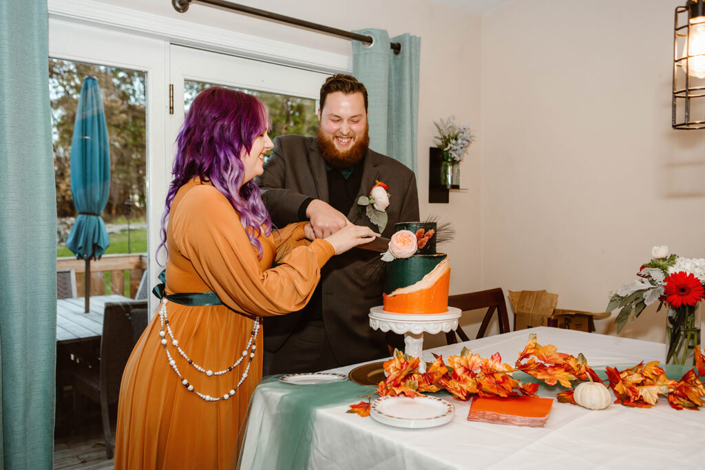the bride and grooming cutting their cake for their elopement