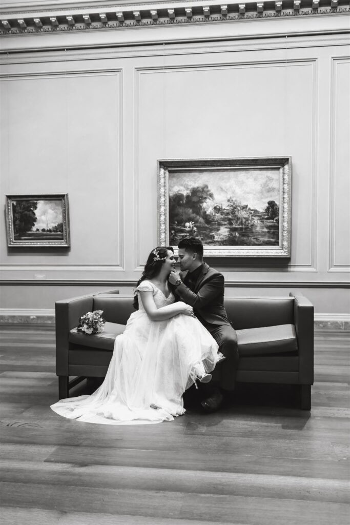 the bride and groom about to kiss at the National Gallery of Art