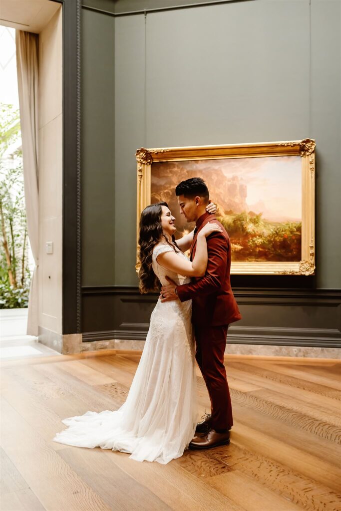 the bride and groom having their first dance at the National Gallery of Art