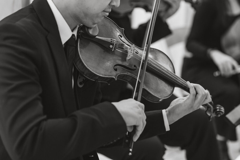the violin playing for a dc war memorial wedding