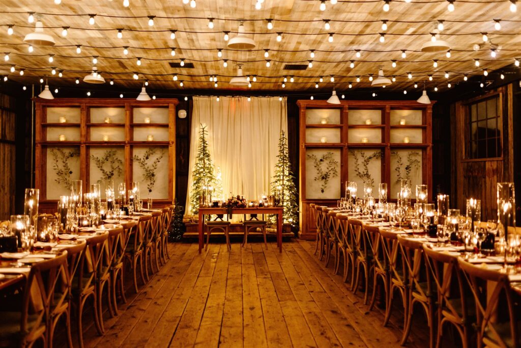 the wedding reception set up for dinner for the winter wedding at the terrain