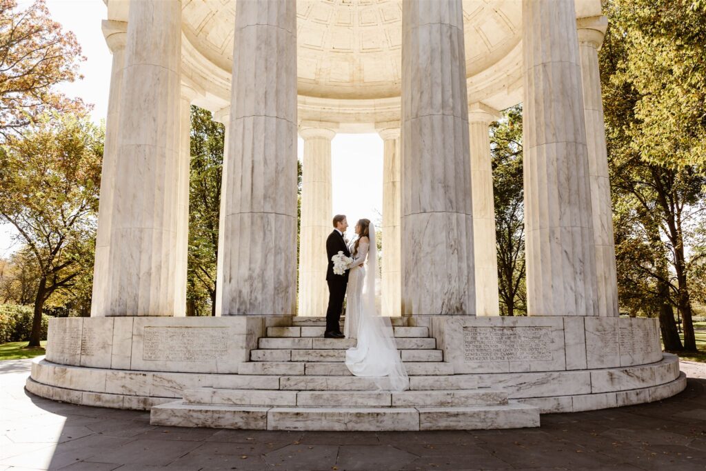 the wedding couple on the steps outside of the war memorial