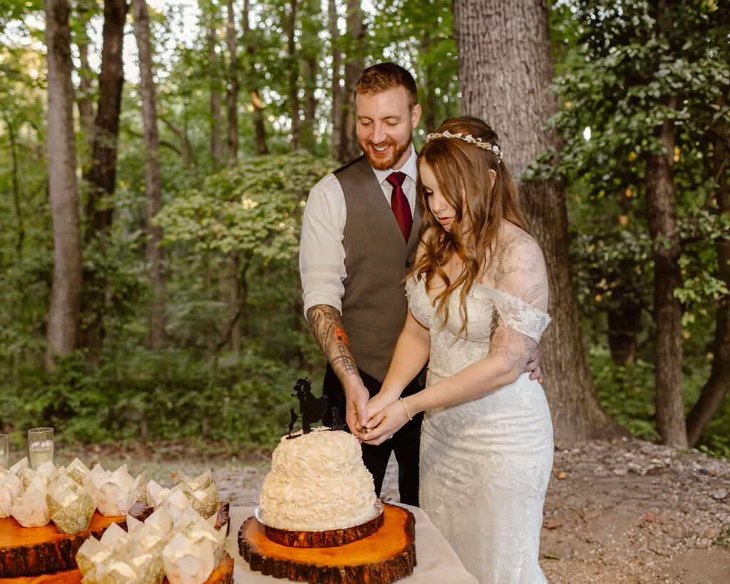 the bride and groom eating cake at the their Maryland elopement