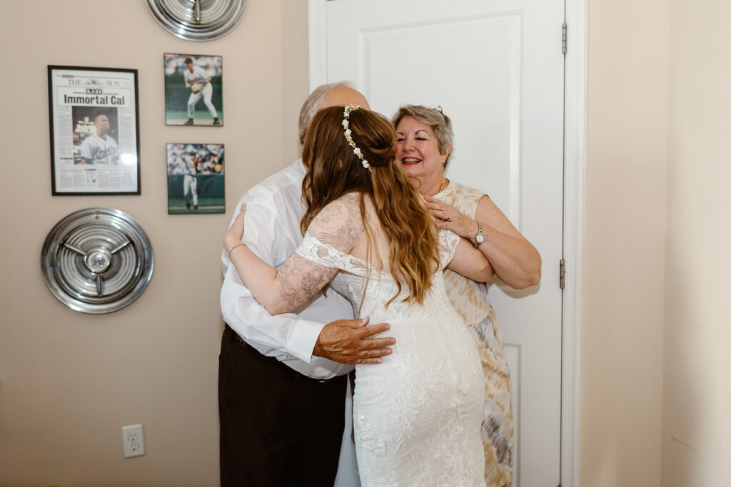 the bride hugging her parents after the first look at her maryland elopement