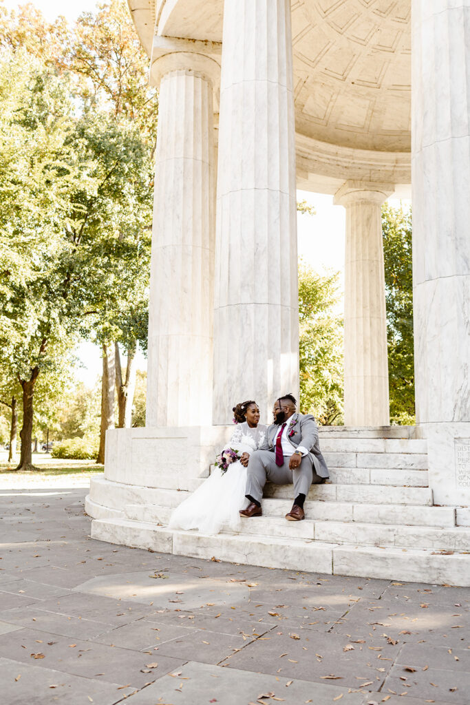wedding couple sitting on the steps for elopement photos in Washington DC