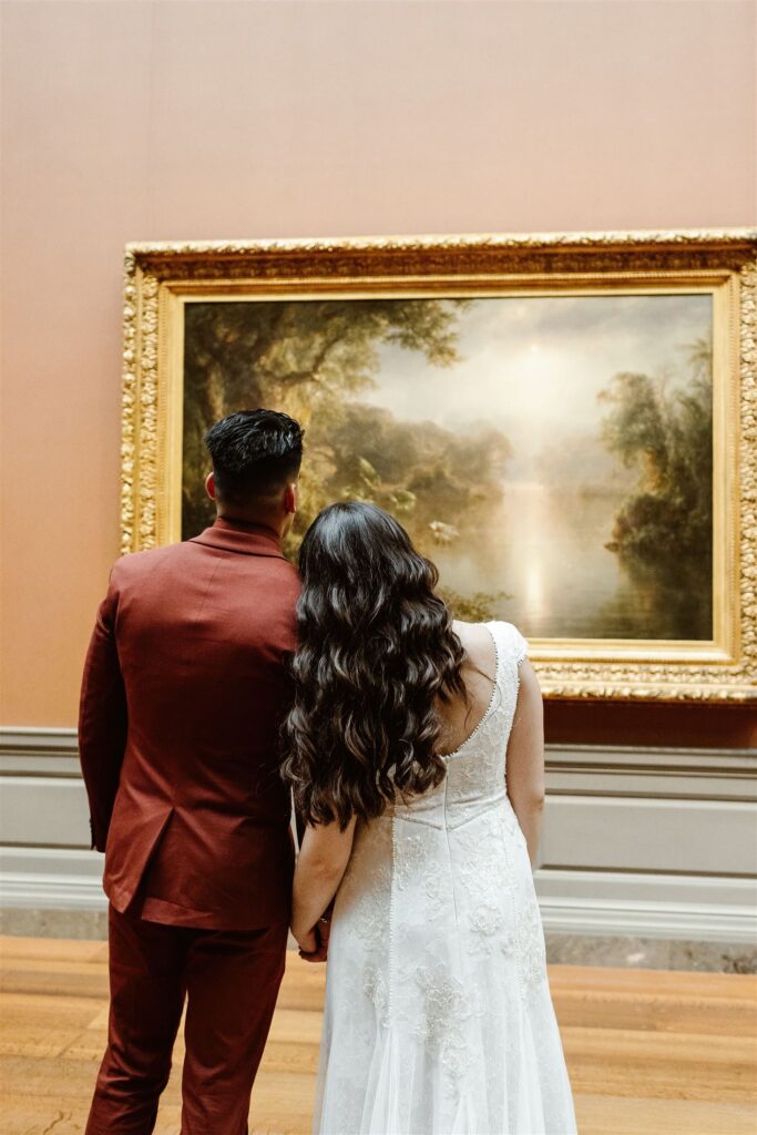 the wedding couple enjoying the art at the National Gallery of Art during their DC elopement