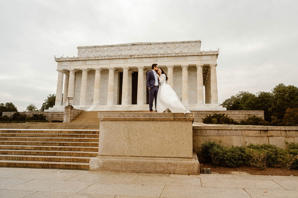 the wedding couple outside of the Lincoln Memorial for elopement photos