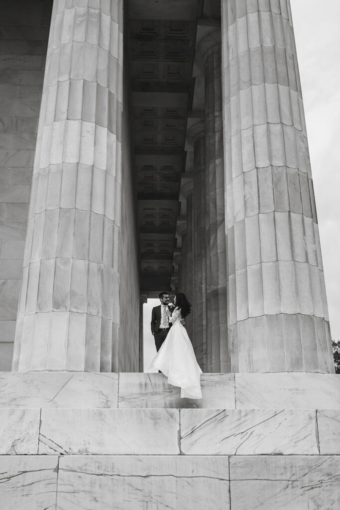 the wedding couple outside of the Lincoln Memorial for DC elopement photos