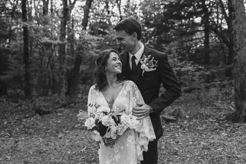 the wedding couple laughing together during their adventure elopement in Shenandoah National Park