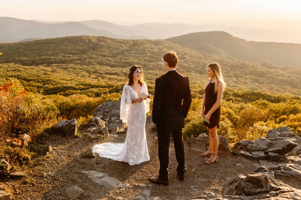 Elopement ceremony in the Virginia mountains during golden hour with officiant in Shenandoah National Park
