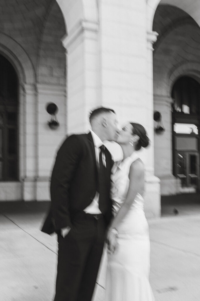 Wedding couple kissing outside of Union Station for romantic elopement photos