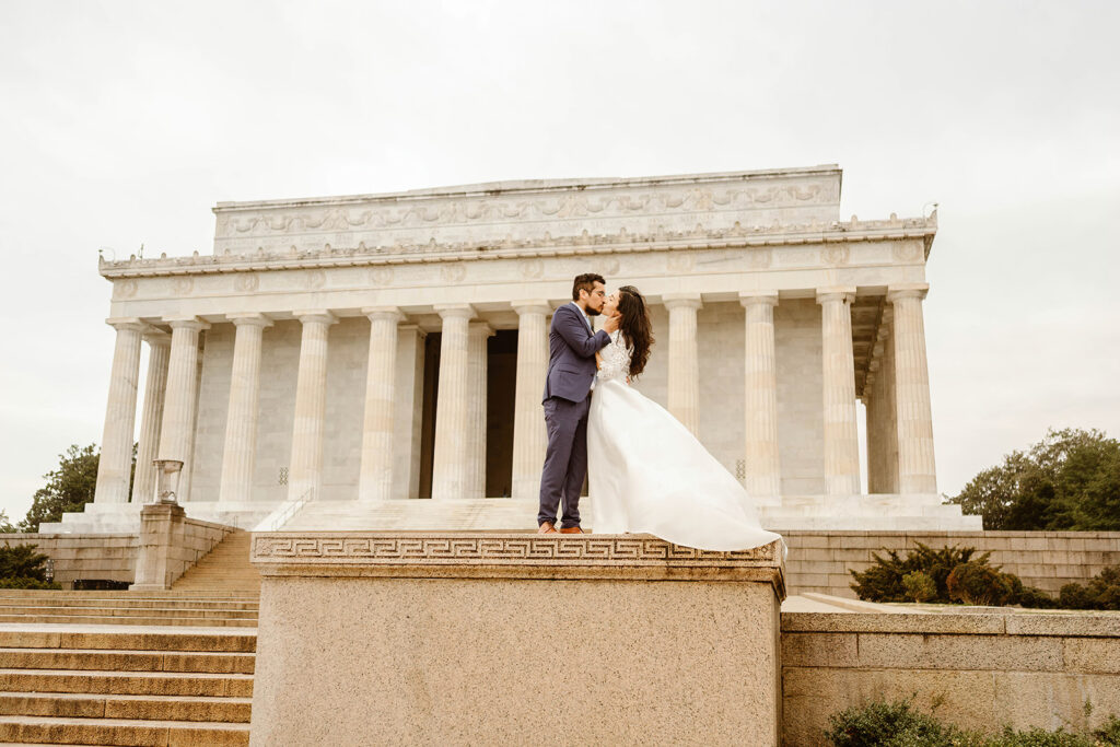 the wedding couple outside of the Lincoln Memorial in Washington DC