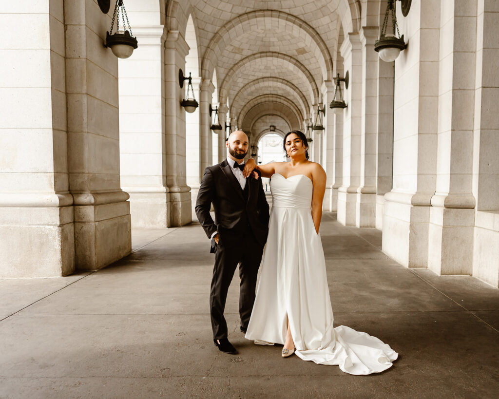 the wedding couple posing at the Union Station for DC elopement photography