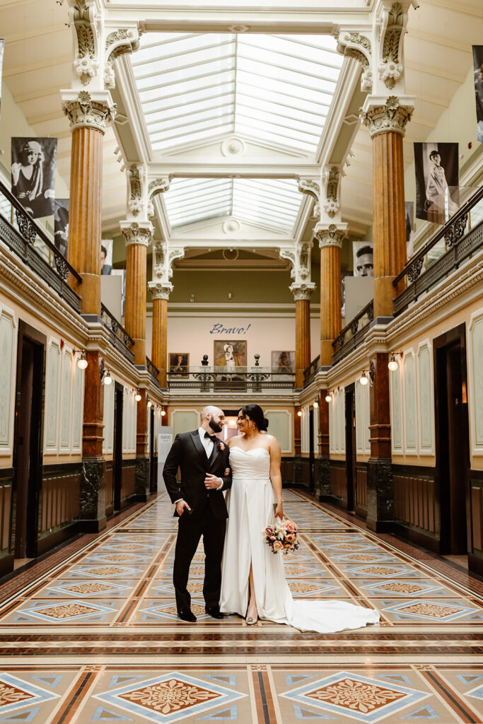 the wedding couple at the art museum for their wedding photography
