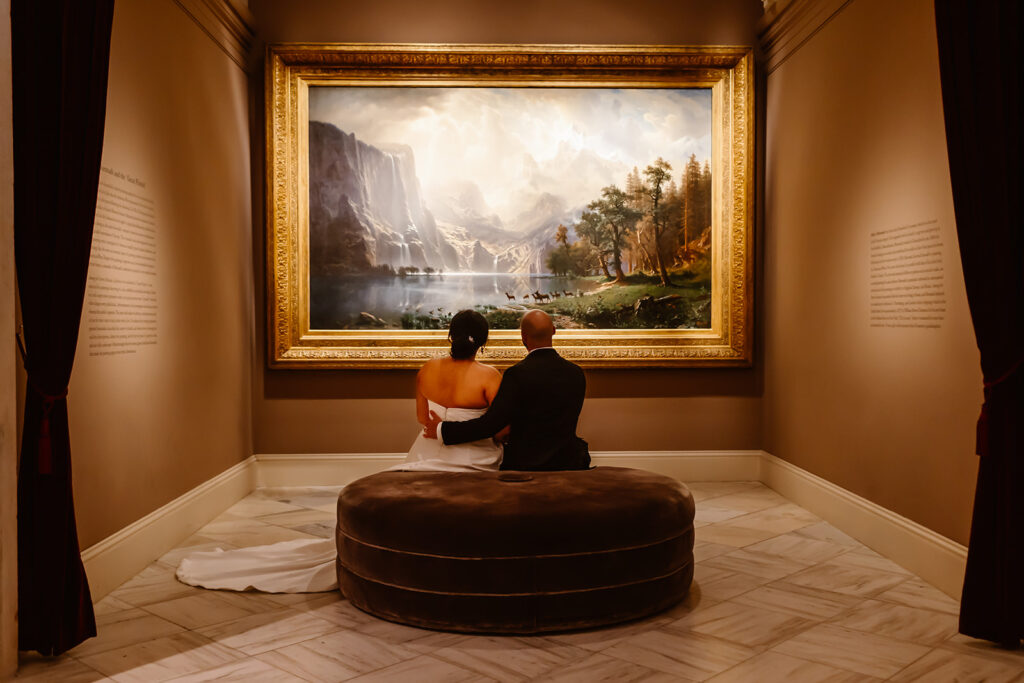 the wedding couple looking at the art together at the art museum in Washington DC
