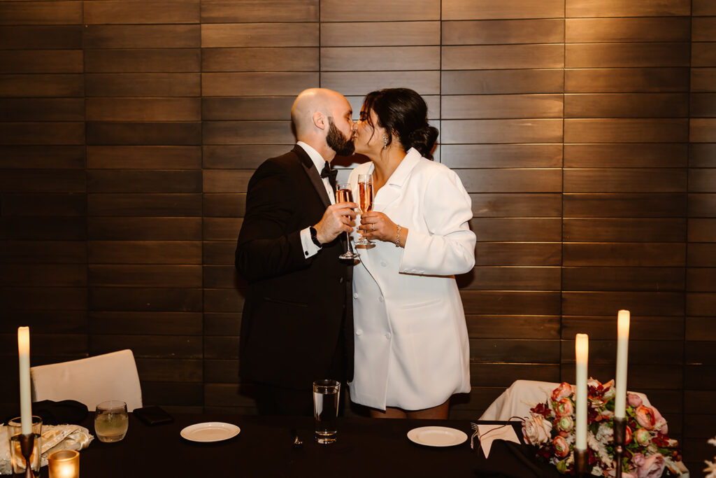 the bride and groom kissing at their wedding reception in Washington DC