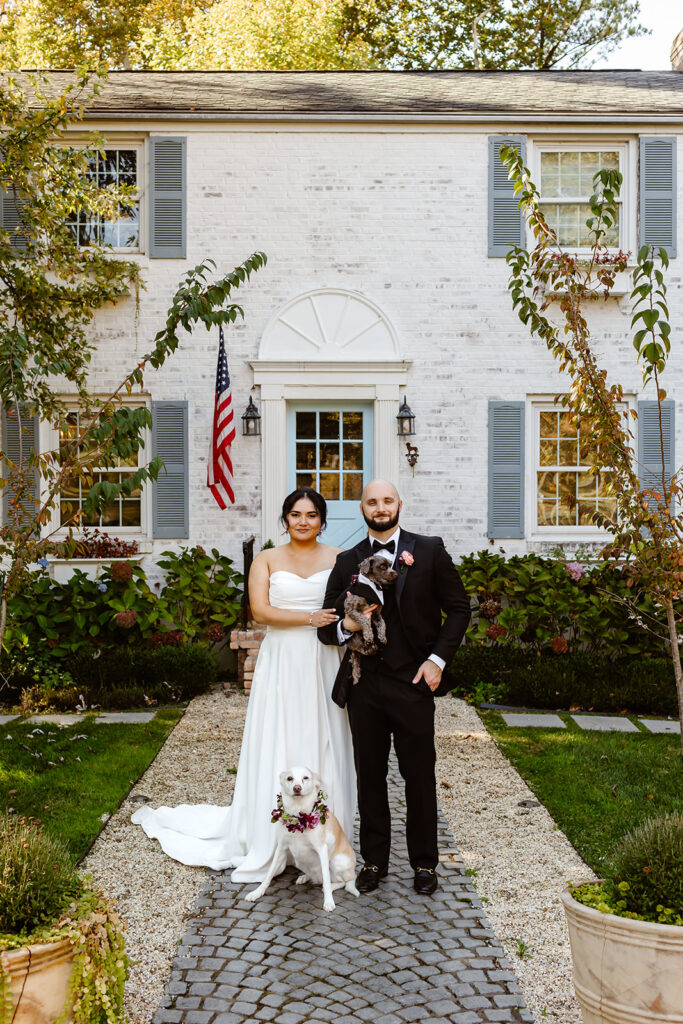 the wedding couple outside of their Airbnb for family wedding portraits in Washington DC
