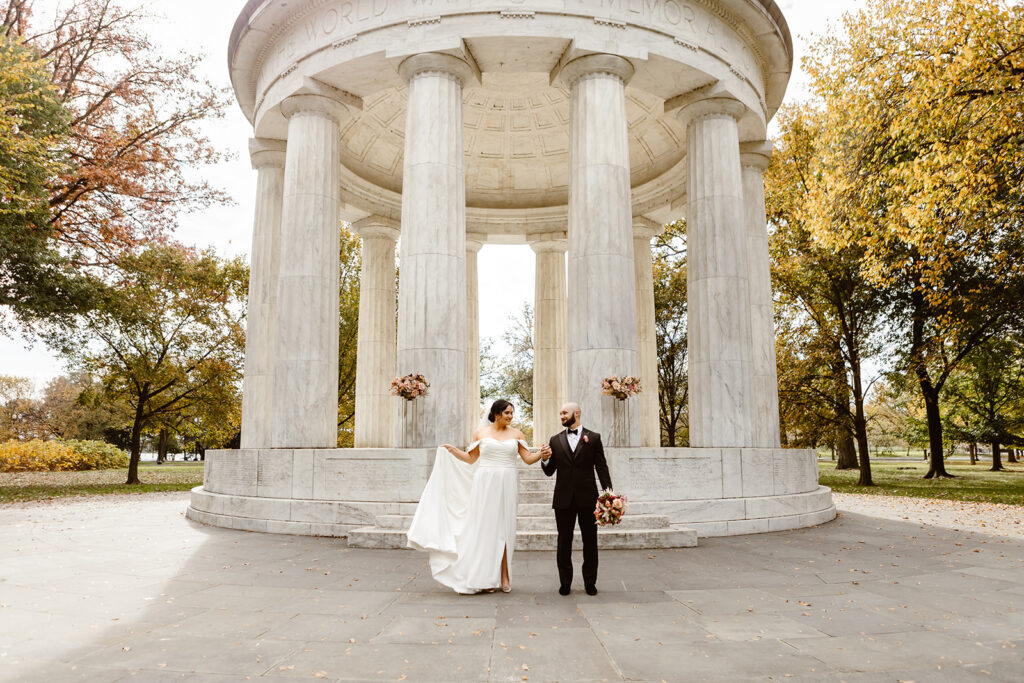 the wedding couple outside of the DC War Memorial for their wedding photos