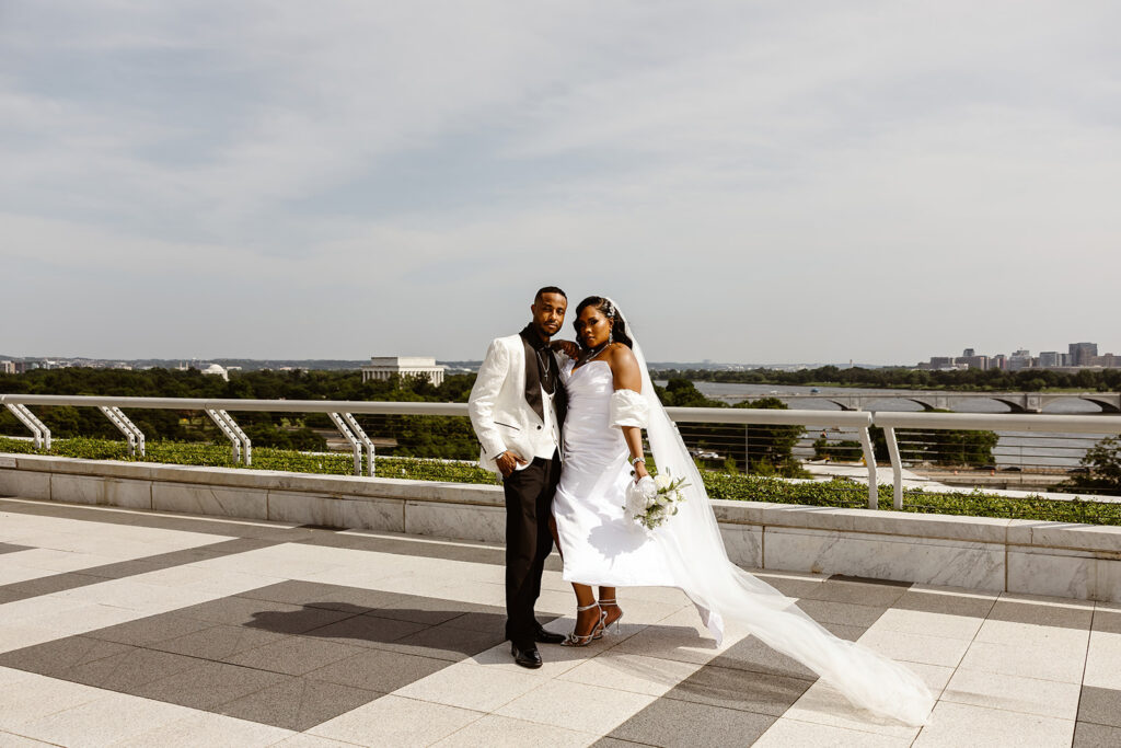 wedding couple on a rooftop at the kennedy center