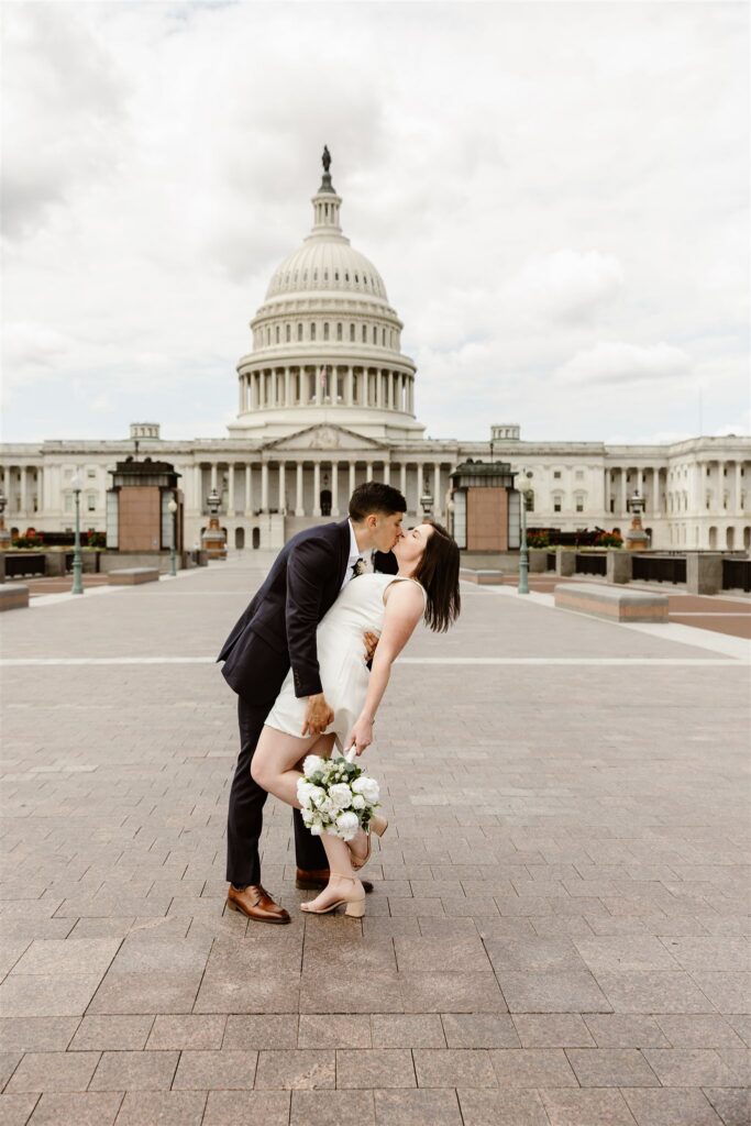 wedding couple exploring the monuments during their washington dc courthouse elopement day