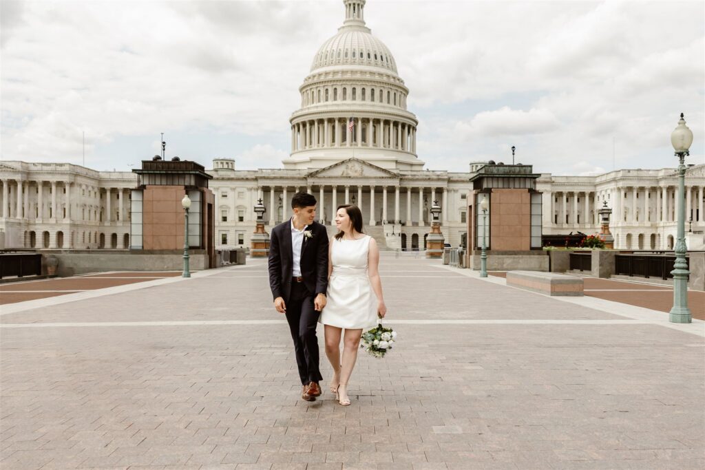 wedding couple exploring the monuments during their washington dc courthouse elopement day