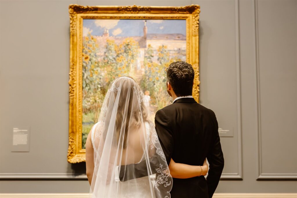 bride and groom looking at art at the national gallery of art in dc