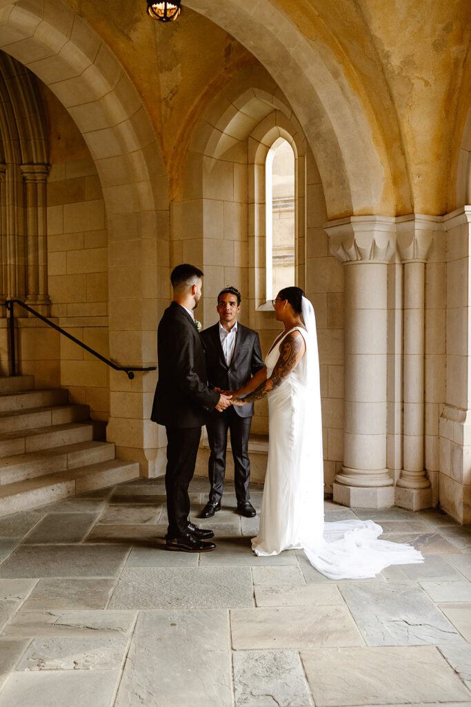 the wedding couple saying their vows at the National Cathedral in Washington DC