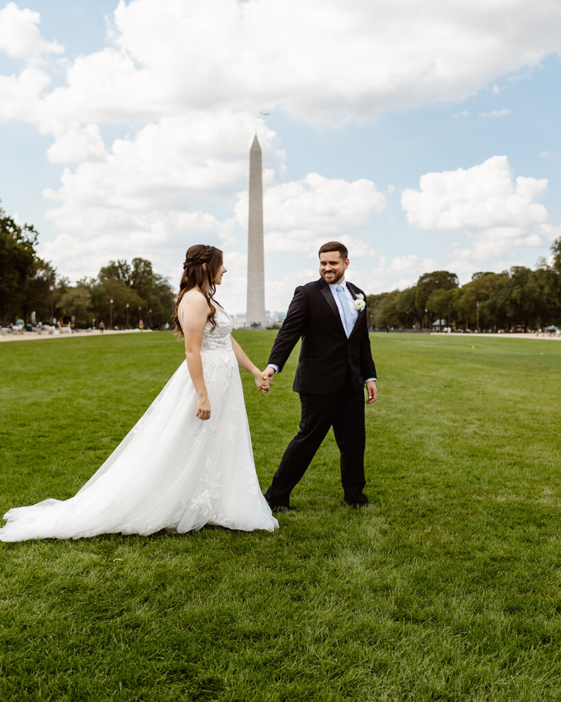 the wedding couple walking together through Washington DC