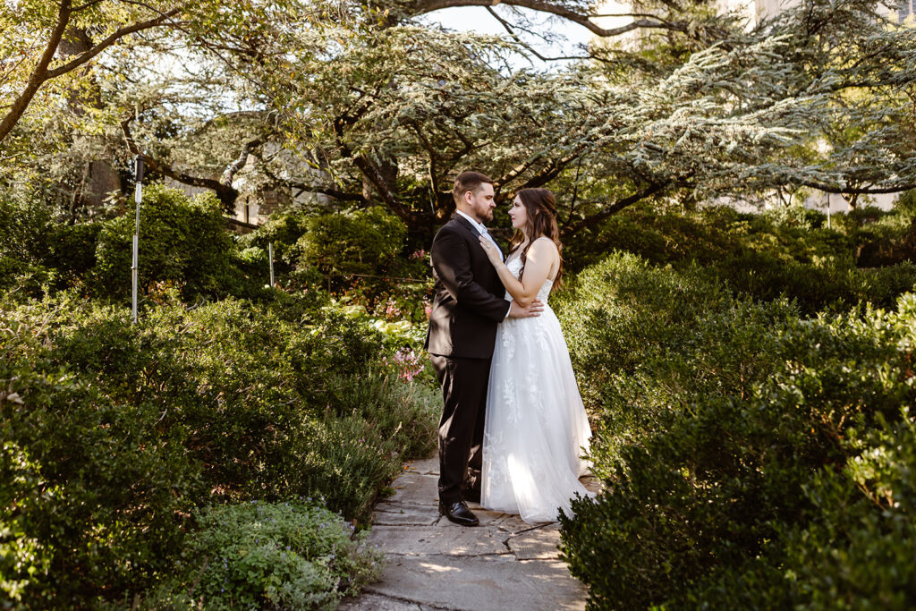 elopement couple walking together through the gardens of the National Cathedral