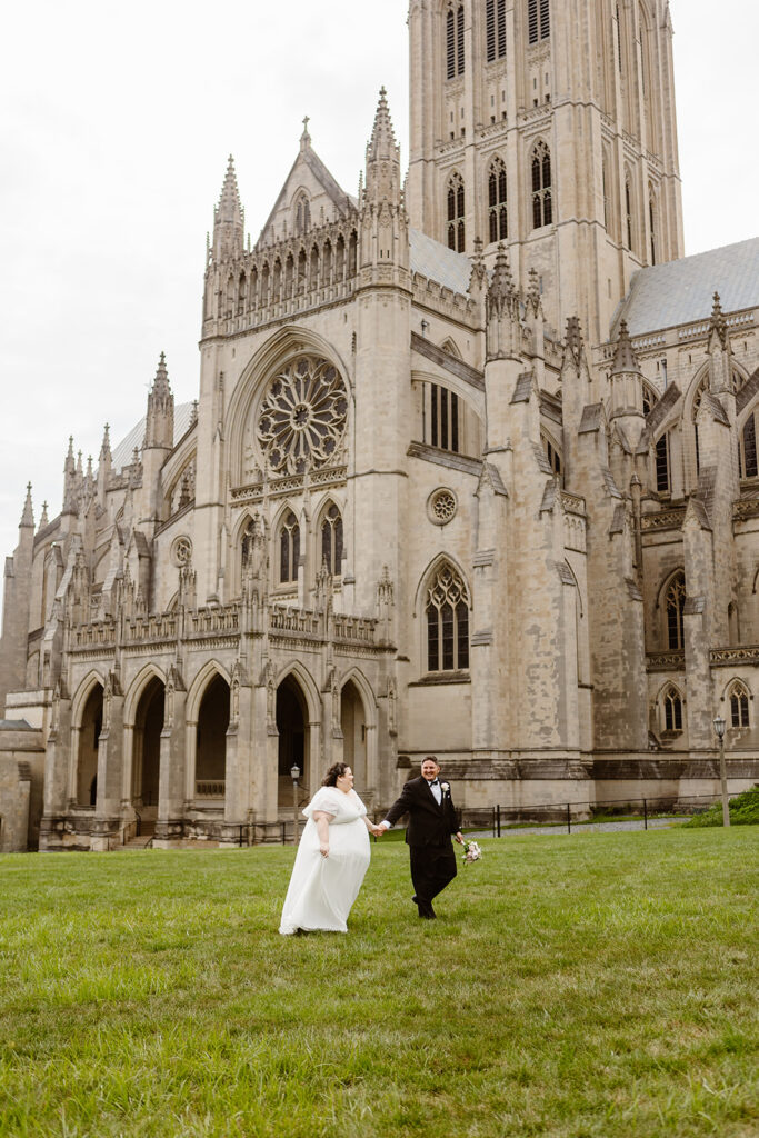 the wedding couple walking together outside of the cathedral in Washington DC