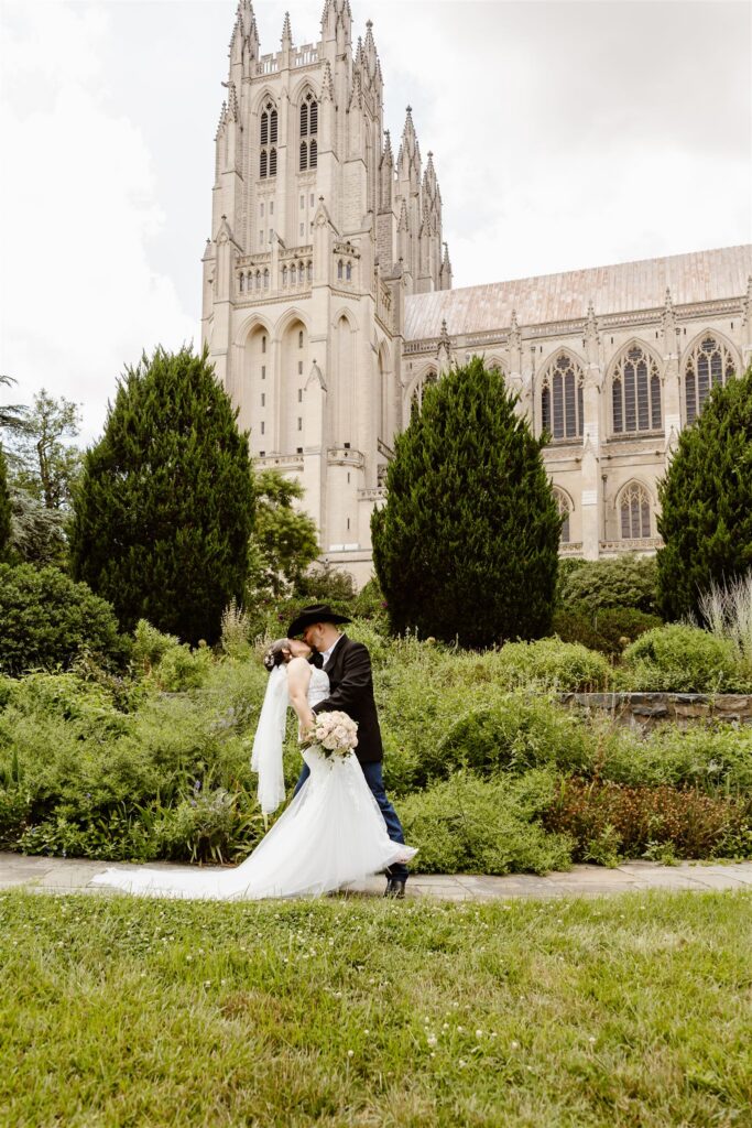 bride and groom dip kiss during their national cathedral elopement in dc