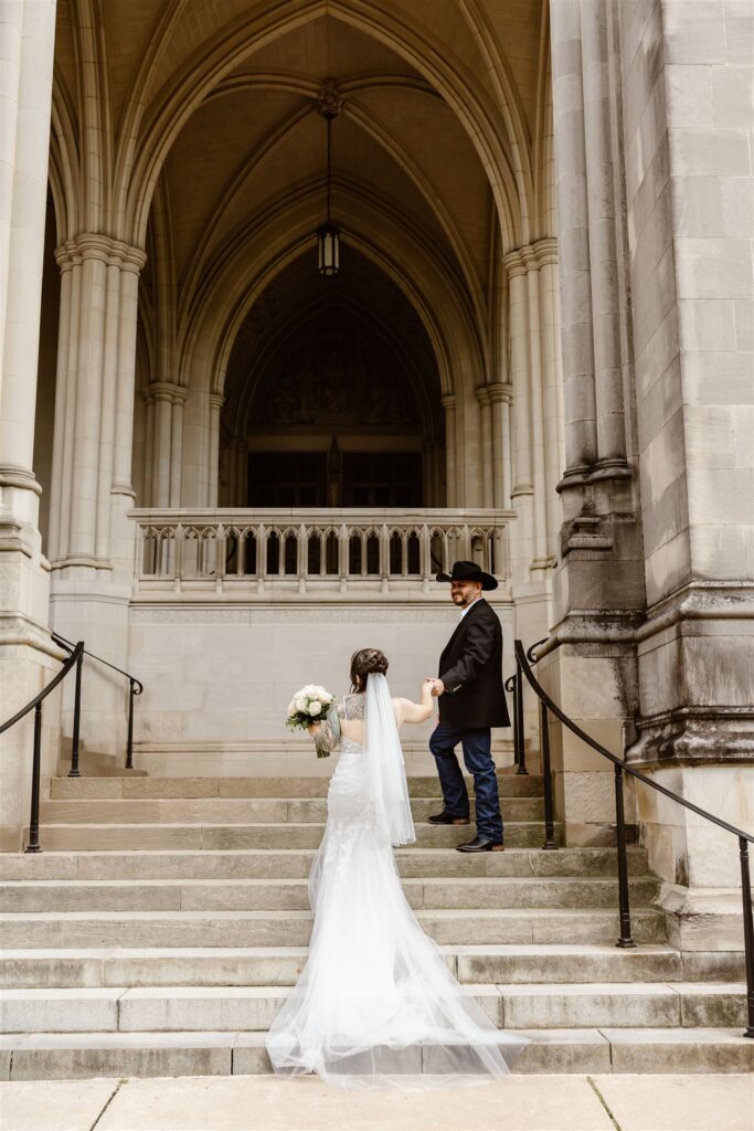 wedding couple posing at the steps of the National Cathedral in Washington DC