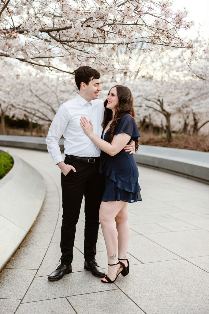the engaged couple enjoying the DC cherry blossoms