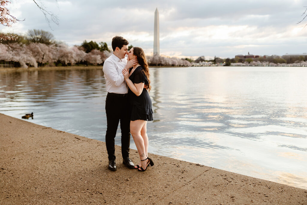 the engaged couple in front of the Washington Monument