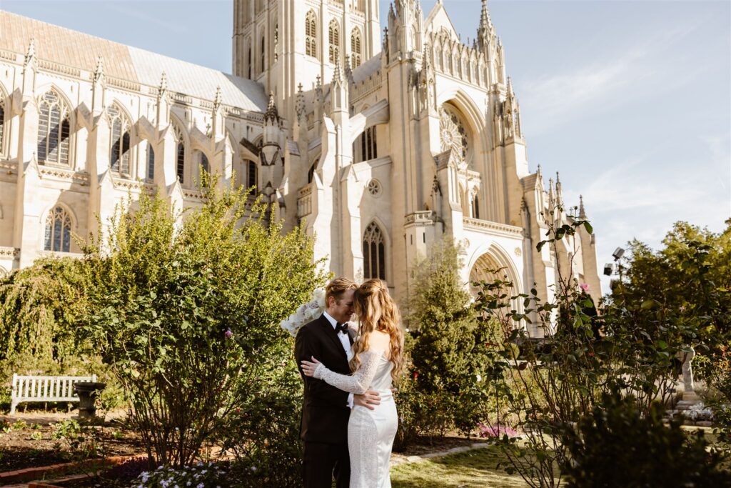 wedding couple posing in front of the National Cathedral in Washington DC