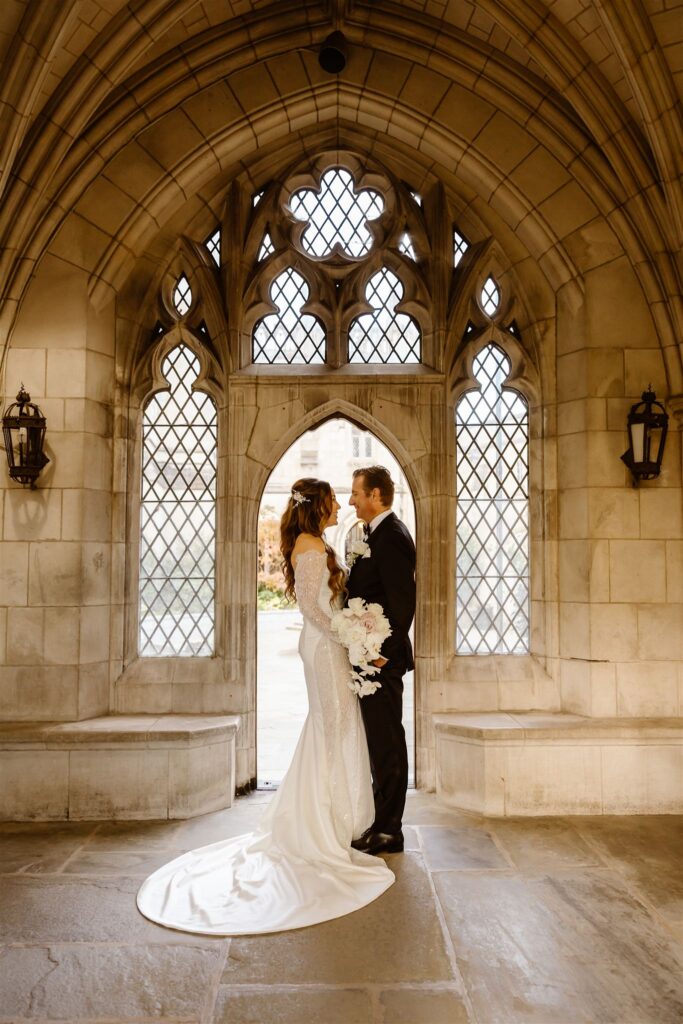 the elopement couple posing inside the National Cathedral